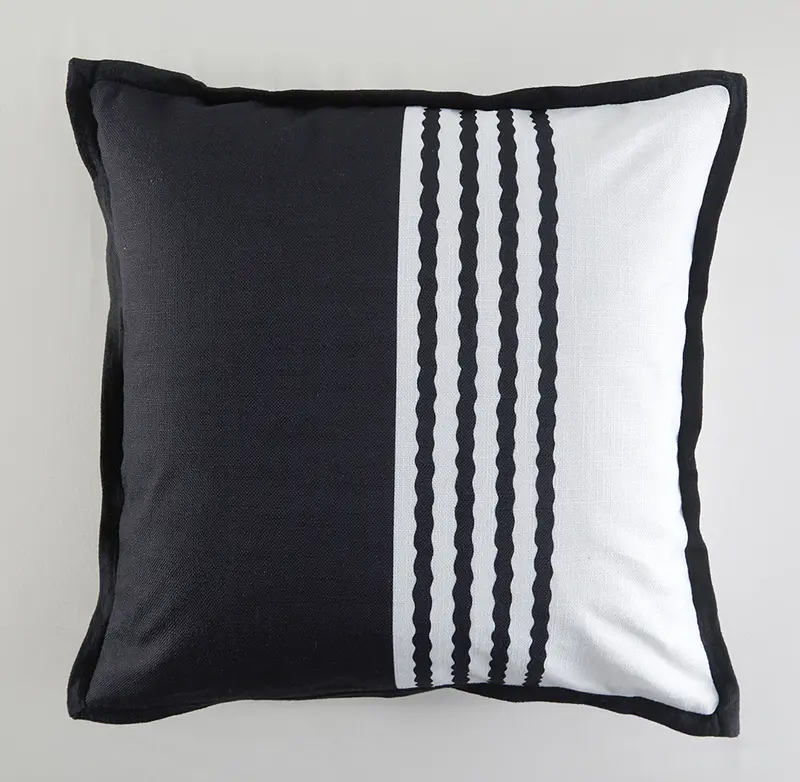 Black And White Striped Outdoor Cushion With Elegant Trim Detailing 1